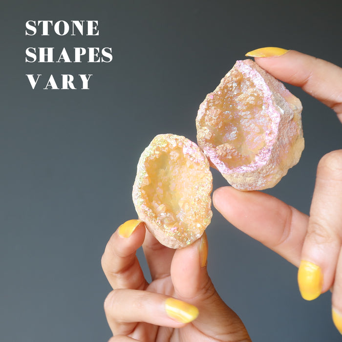 two rainbow aura quartz geodes showing varying shape