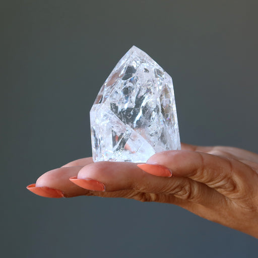 Rainbow Crackle Quartz Point Tower on the model palm