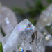 showing the tip of Rainbow Crackle Quartz Point Wand Tower
