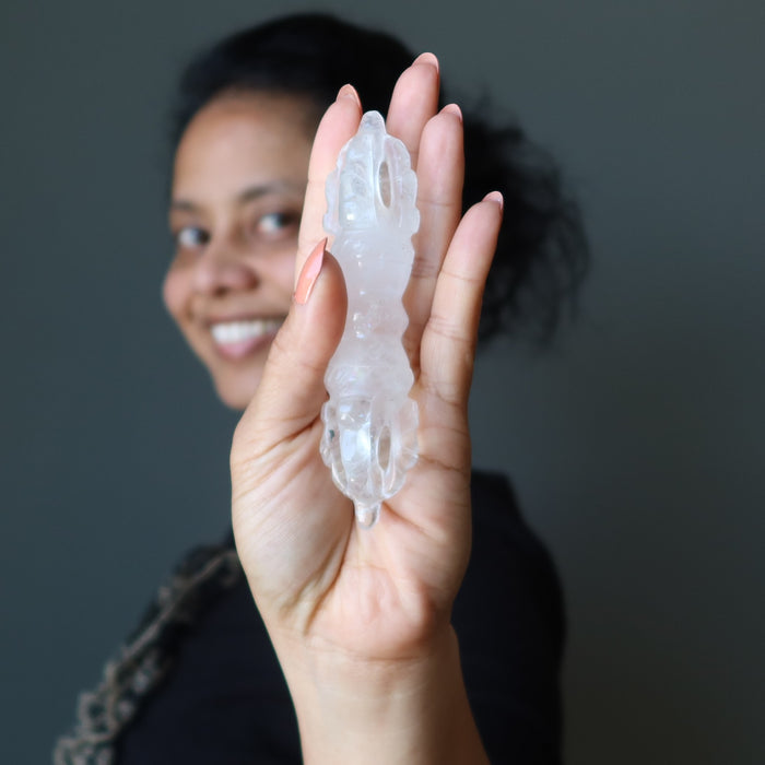 hand holding clear quartz dorje wand