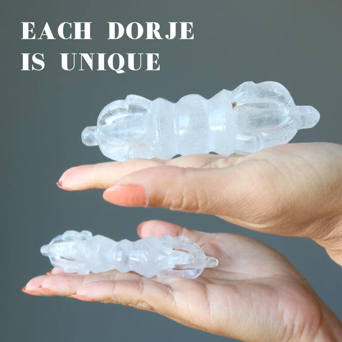 hands holding clear quartz dorje wands showing each is unique