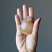 model hand holding Golden Quartz Egg