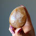 hand holding Golden Quartz Egg