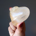 holding Golden Milky Hematoid Quartz Heart