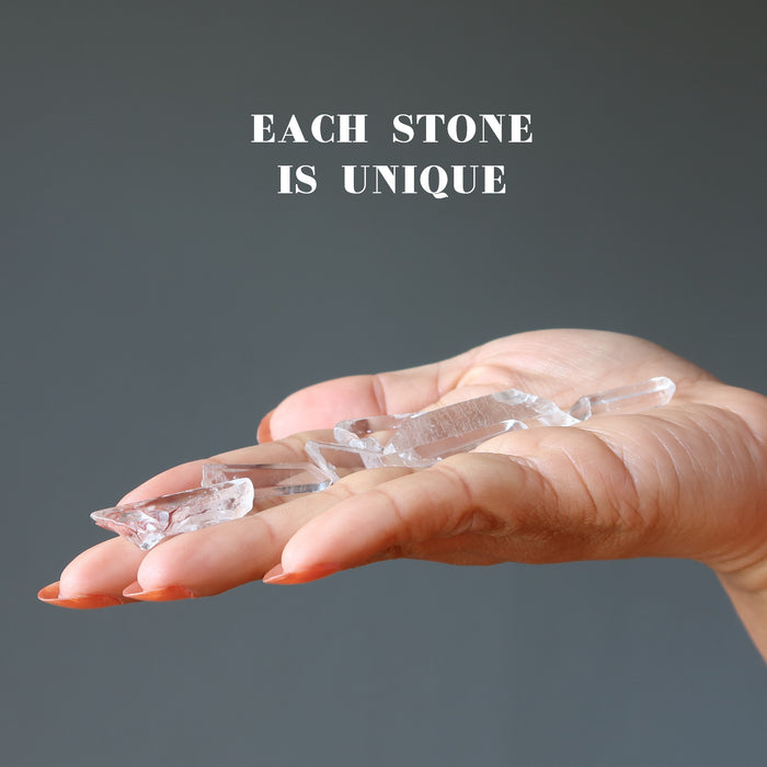 Raw Clear Quartz Points on the palm each stone is unique