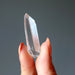 holding Raw Clear Quartz Point