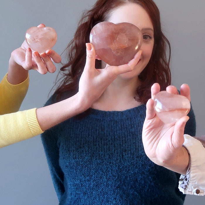 woman surrounded by red fire quartz heart