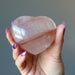 hand holding red fire quartz heart