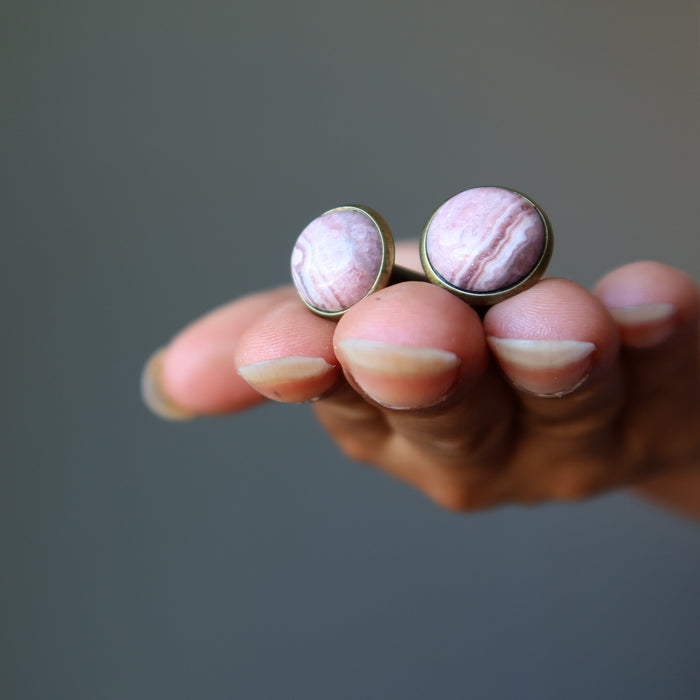 rhodochrosite cufflinks in hand