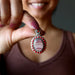 rhodochrosite and coral pendant