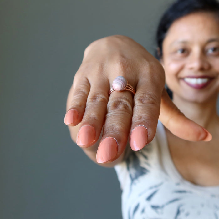 sheila of satin crystals wearing a rhodochrosite ring