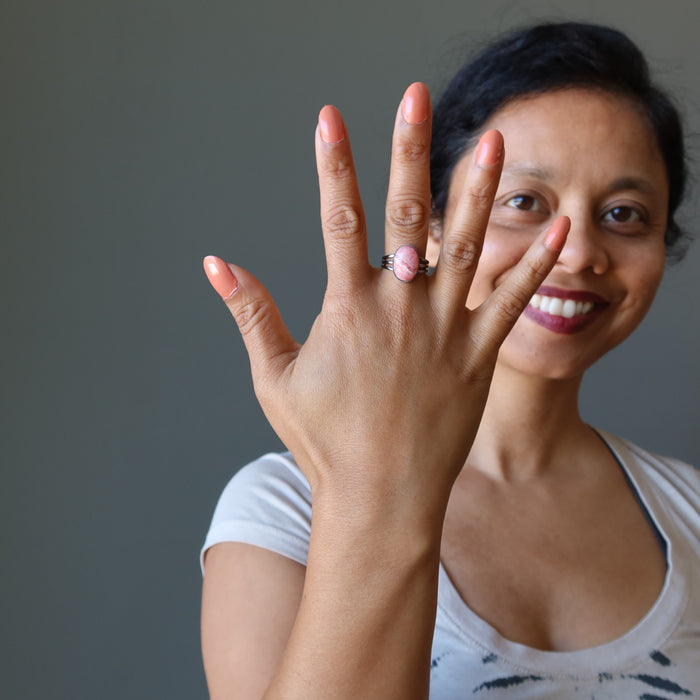 sheila of satin crystals wearing a rhodochrosite gemstone in gunmetal ring