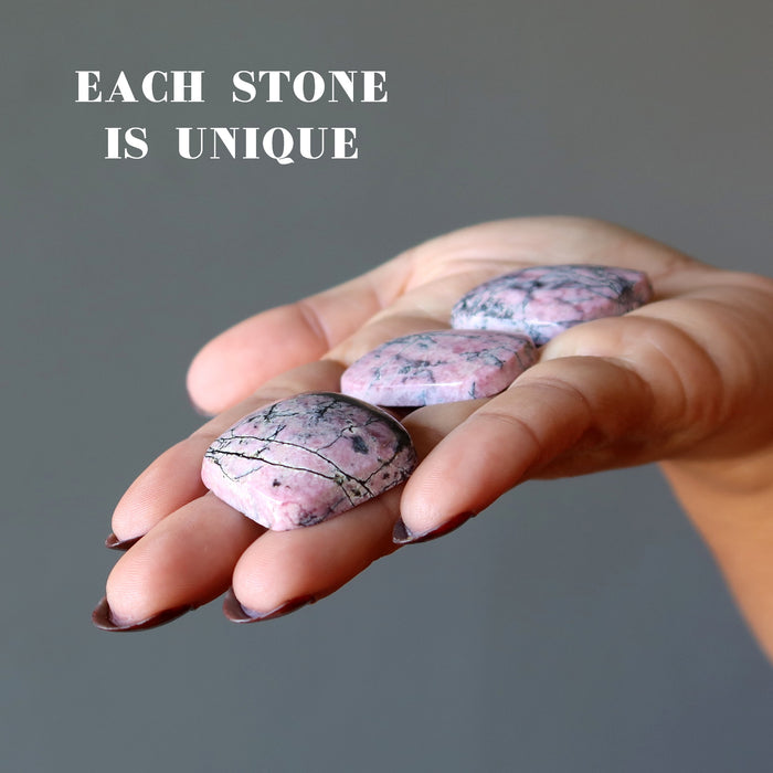 three rhodonite cabochons