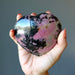 rhodonite heart in hand
