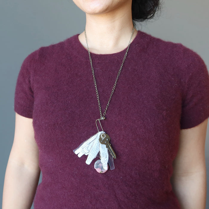 woman wearing rhodonite key necklace