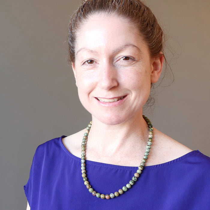 woman wearing rhyolite necklace