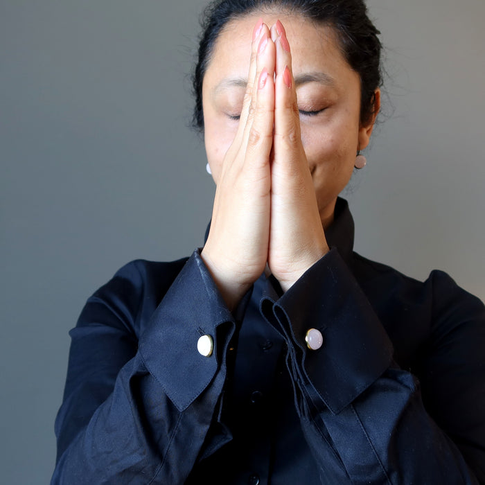 sheila of satin crystals wearing pink rose quartz cufflinks on a black french cuff shirt