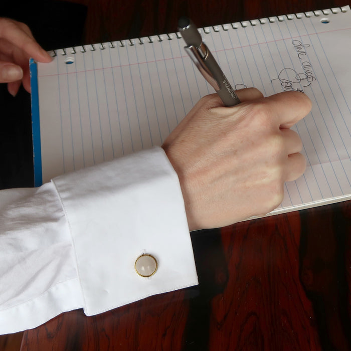 lady writing wearing rose quartz gold cufflinks