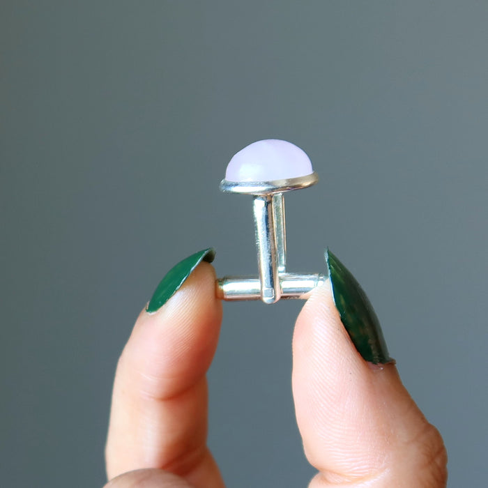 hand holding rose quartz silver cufflink