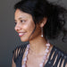 sheila of satin crystals wearing faceted rose quartz on hammered sterling silver earrings