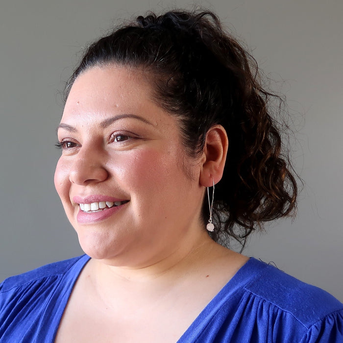 sotera of satin crystals wearing faceted rose quartz on hammered sterling silver earrings