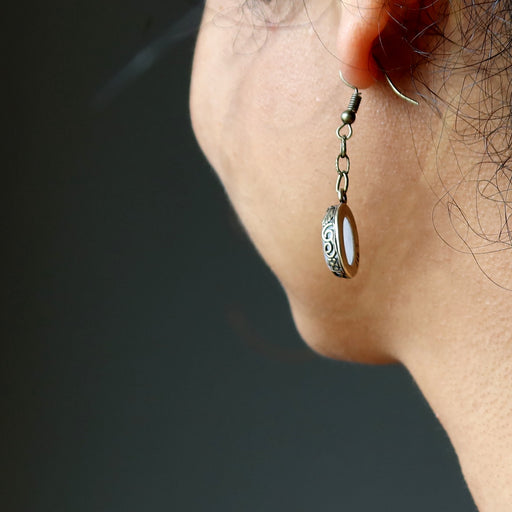 rose quartz earring on ear