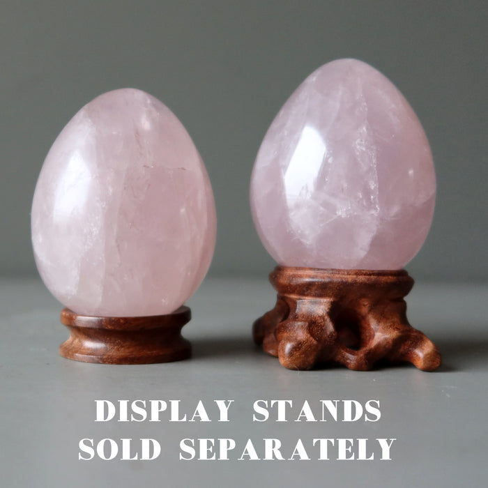 pink rose quartz eggs on display stands