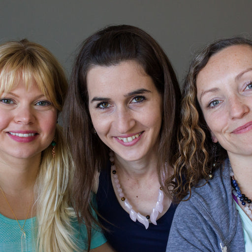 three females wearing rose quartz flame necklaces
