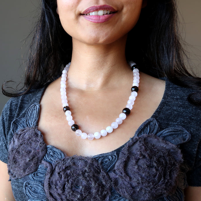 rose quartz and smoky quartz necklace on female