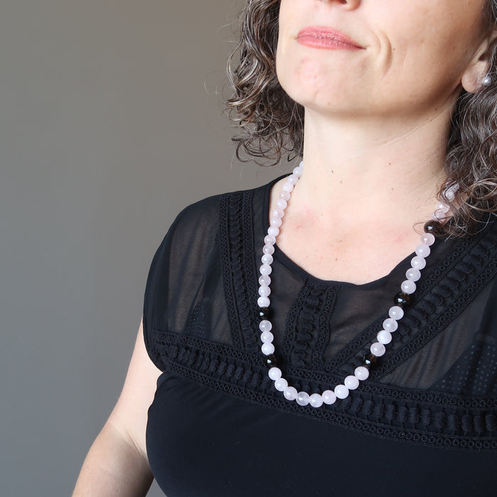 rose quartz and smoky quartz necklace on female