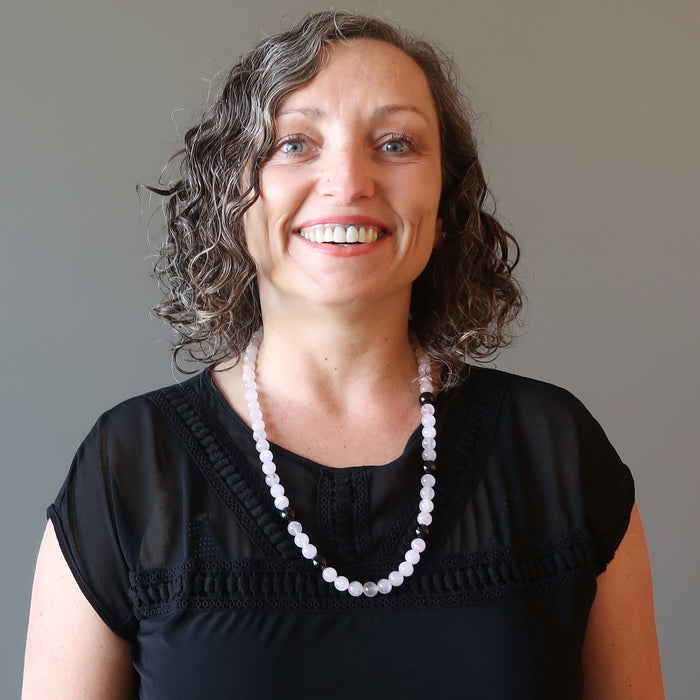 female wearing rose quartz and smoky quartz necklace
