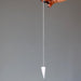hand holding rose quartz pendulum