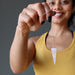 sheila of satin crystals holding a pink rose quartz pendulum