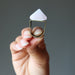 hand holding rose quartz pyramid ring