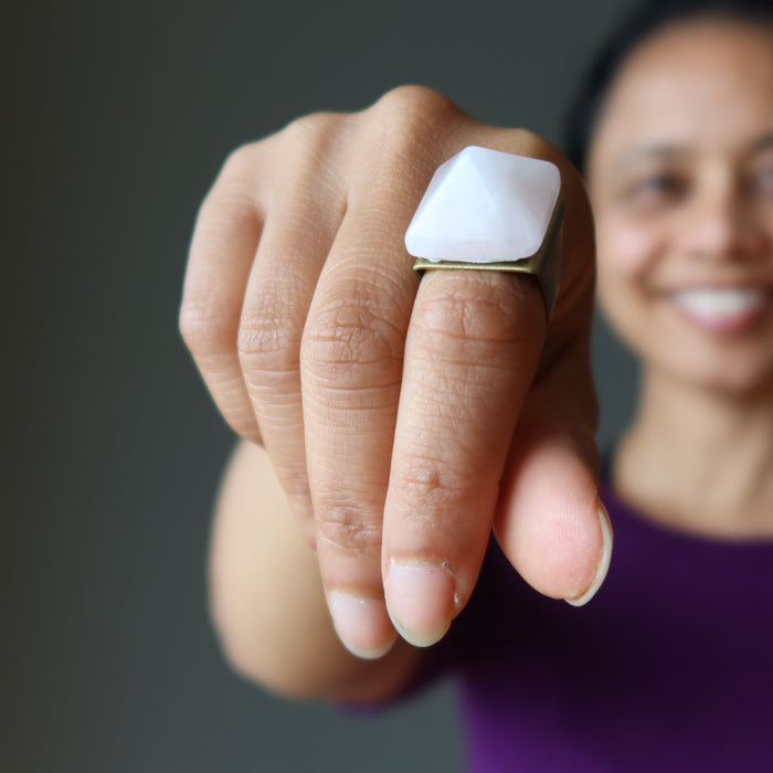 female wearing rose quartz pyramid ring