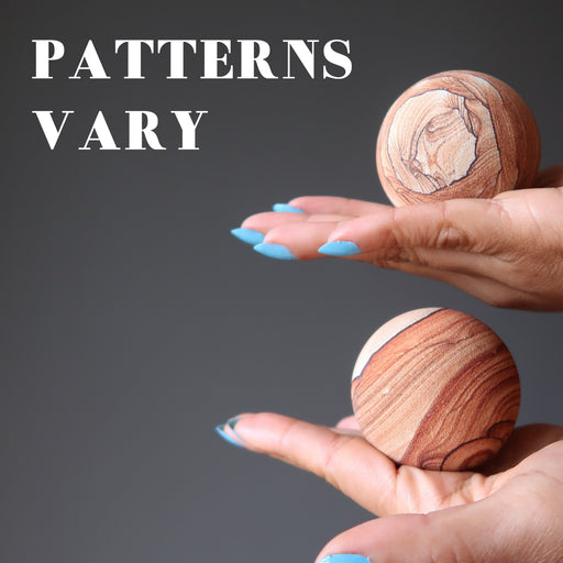 two sandstone spheres showing varying patterns