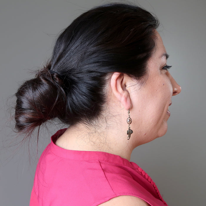 female model wearing sardonyx elephant earrings