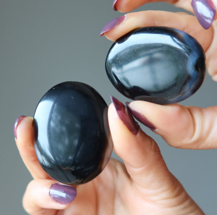 pair of black and brown sardonyx oval stones