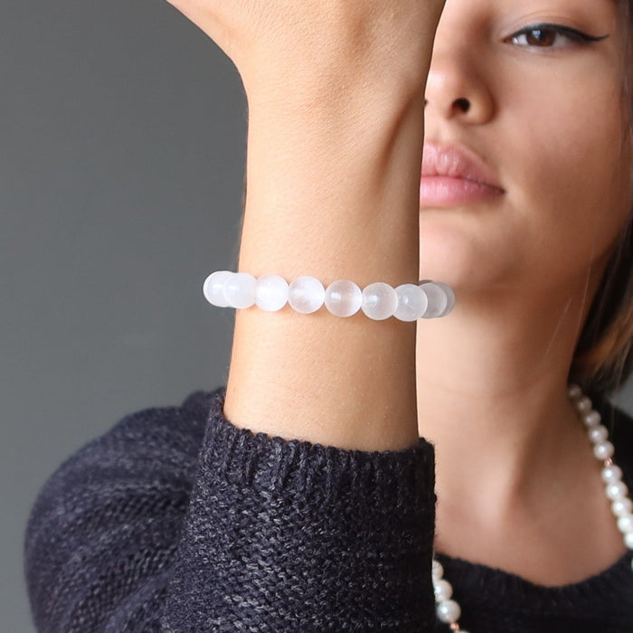 woman modeling selenite bracelet