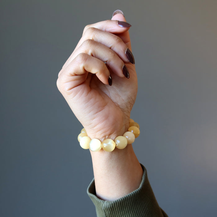 orange selenite bracelet on wrist