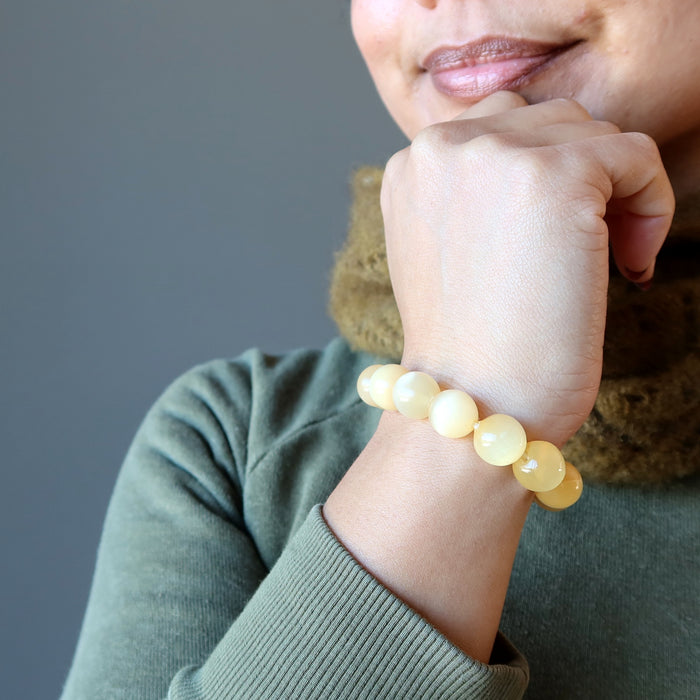 orange selenite bracelet on wrist