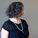 female wearing selenite goddess necklace