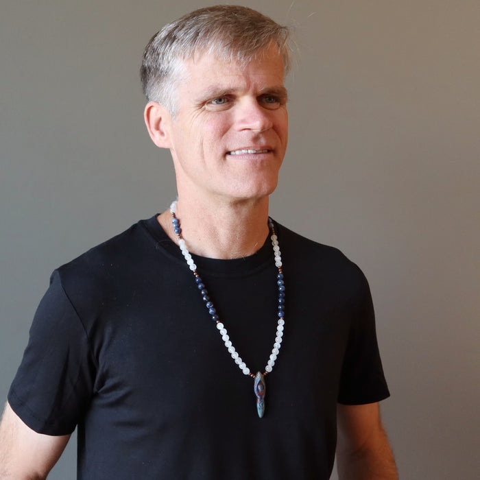 male wearing selenite sodalite goddess necklace