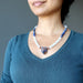 selenite sodalite wolf necklace on female neck