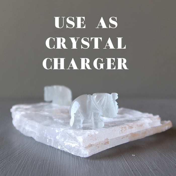 elephants on a true selenite crystals used as a crystal charger