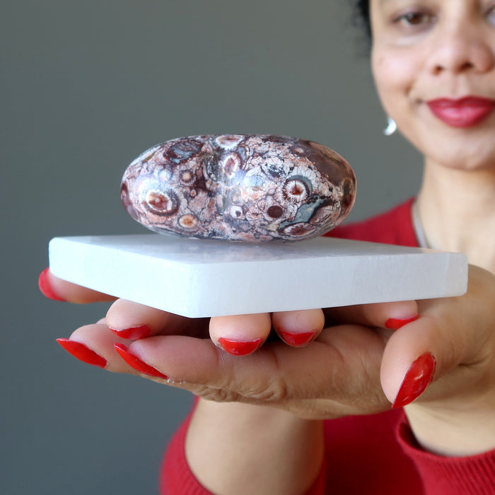 selenite charging station with rhyolite heart