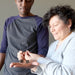 couple admiring silver and orange sericho meteorite cubes