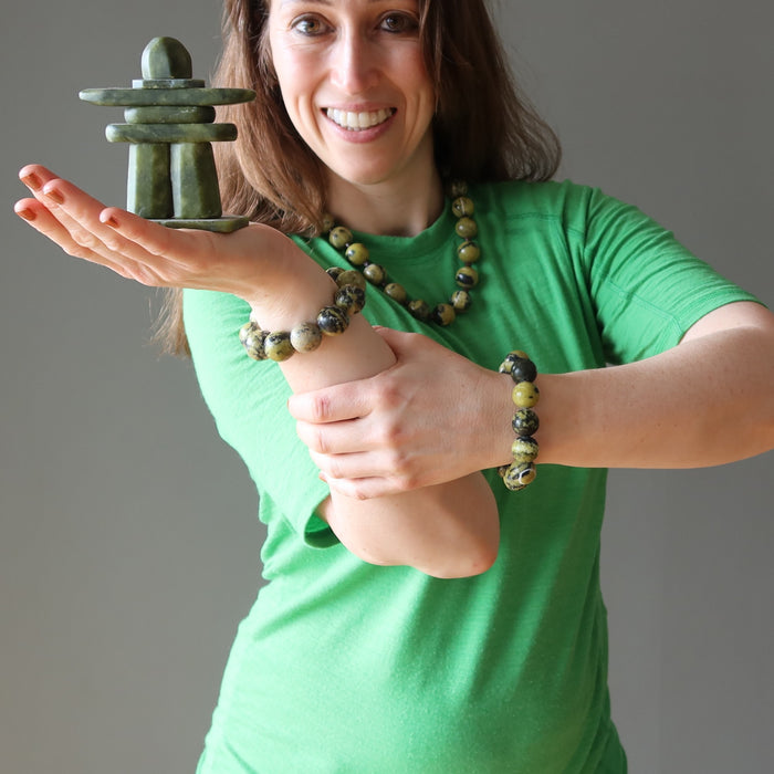 woman holding and wearing serpentine