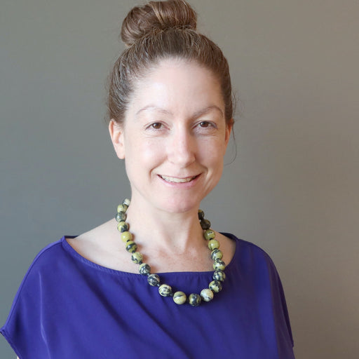 female wearing serpentine necklace