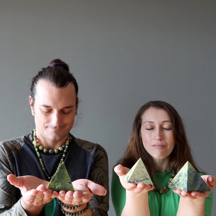 couple meditating with serpentine pyramids